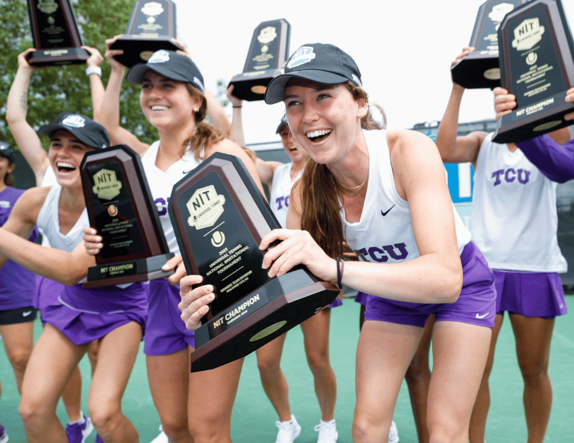 TCU women's tennis team celebrates their Universal Tennis NIT Championship title by holding the college tennis trophies